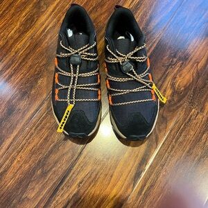 Black and Orange Sneakers with Yellow Accents
